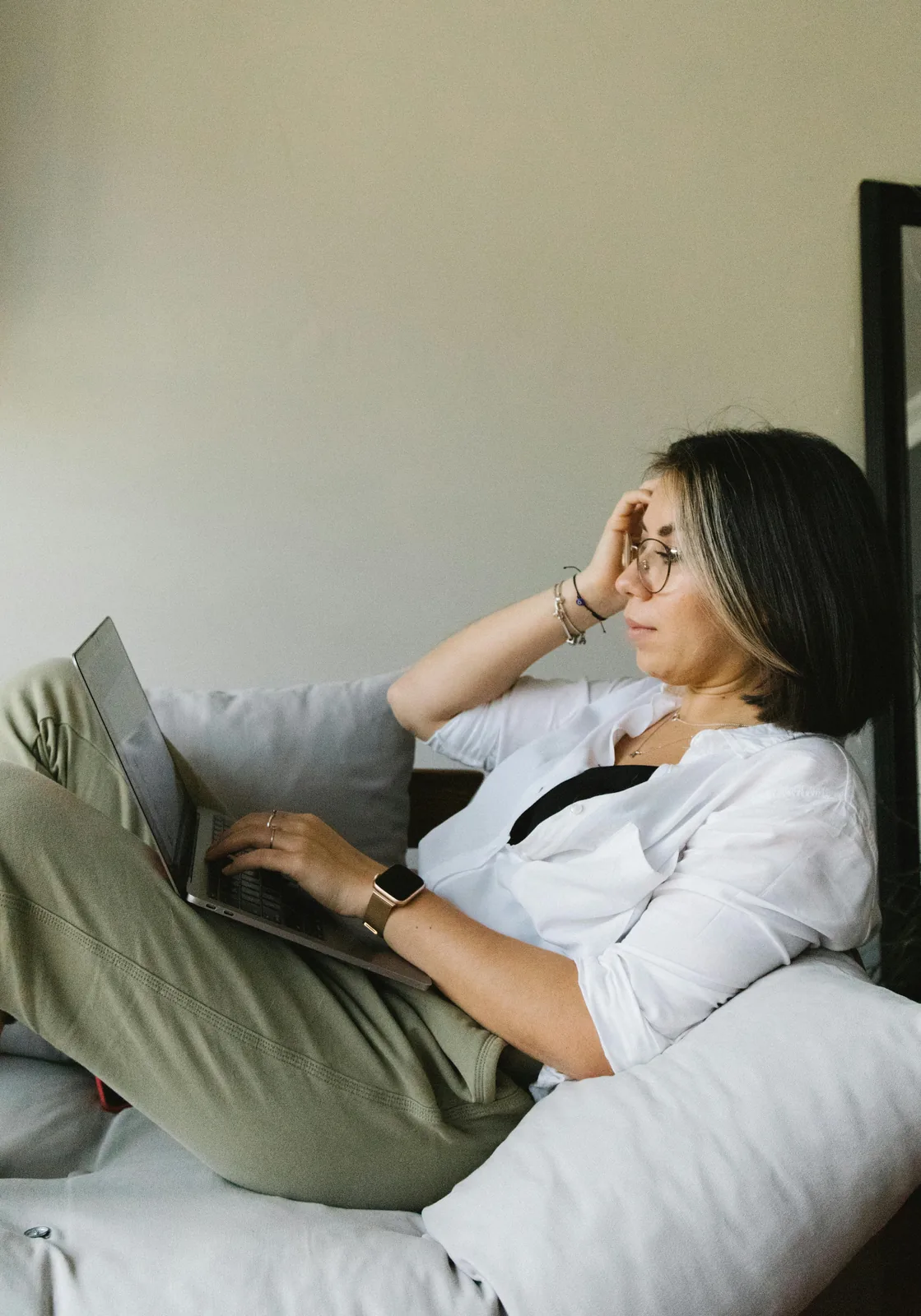 Freelancer focused on laptop work from a calm and relaxed setting.